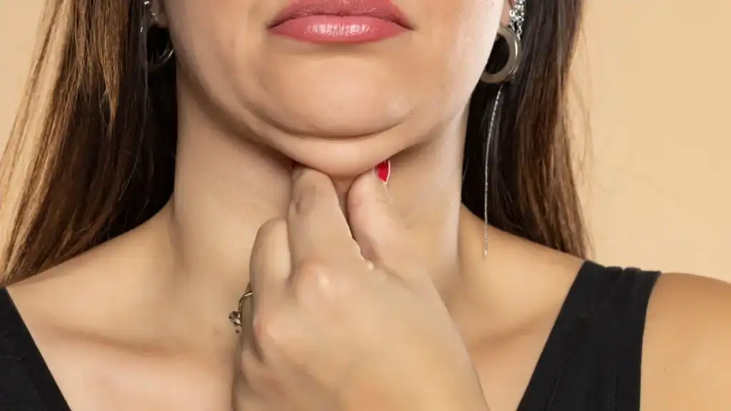 An image of a woman with double chin, sad, worried : Non Surgical Double Chin Removal Treatment in Witney, UK